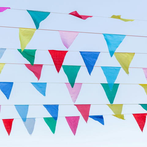 Festival bunting against a blue sky