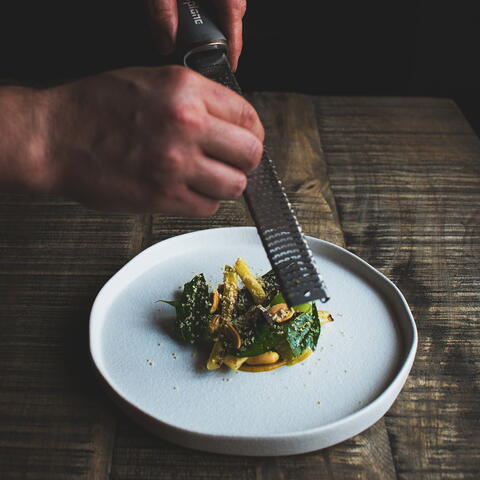Lemon zest being grated over food