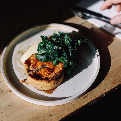 Plate of vegetable tart and greens