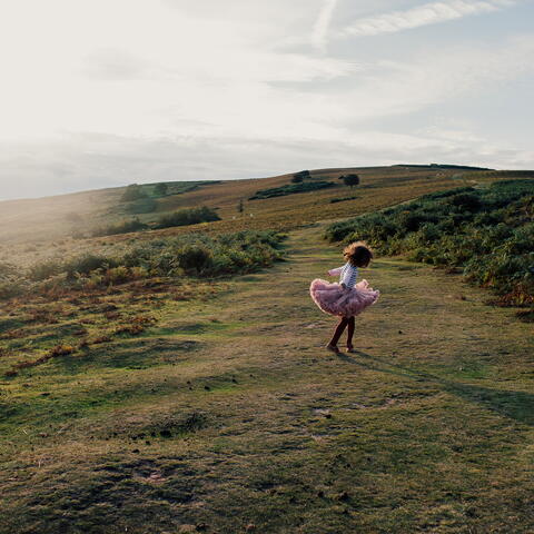 Girl running free on Garway Hill