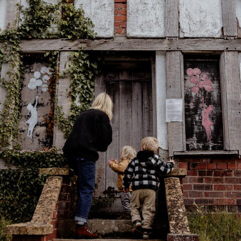 Young family explore half-timbered house