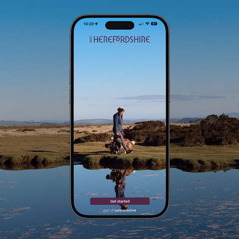 App screen overlaid on a Herefordshire landscape