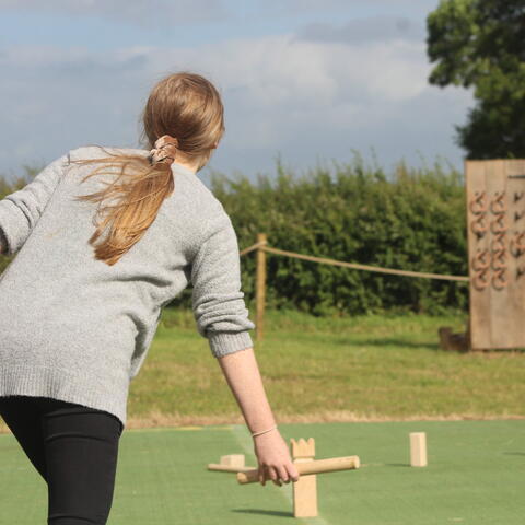 Girl playing wooden Mollke game