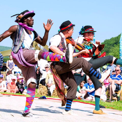 Three Men Dancing