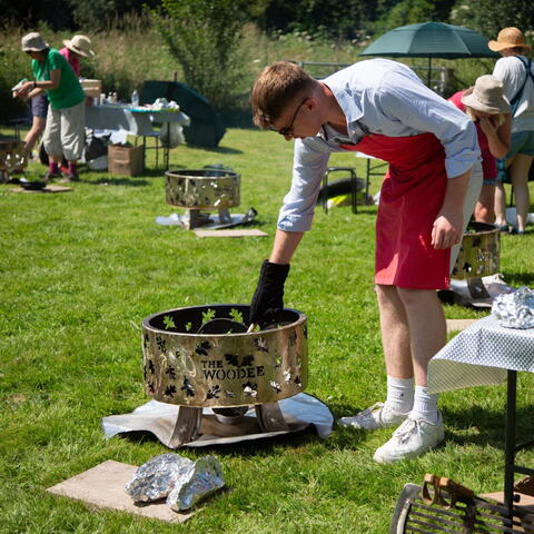Man using the open grill to cook