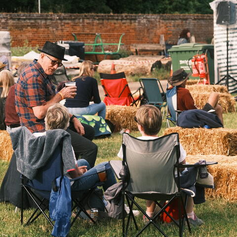 People enjoying a picnic and live music