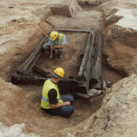 2 people excavating a ruin