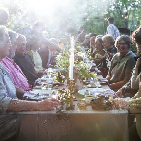 People sat at a table in the garden