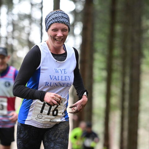 Lady running in the woods