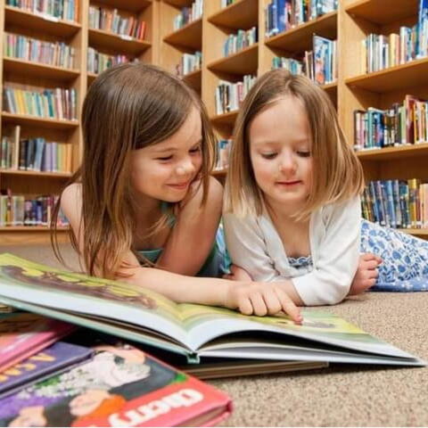 2 children reading books