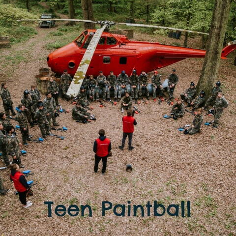 Teens being breifed outside a helicopter