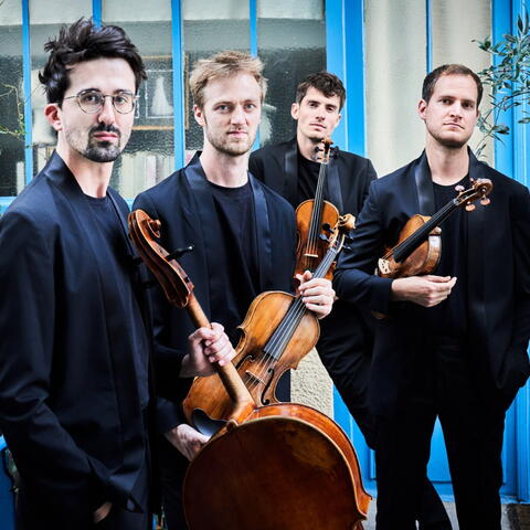 Four musicians with instruments