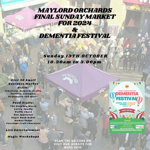 Poster with writing over an image of a market