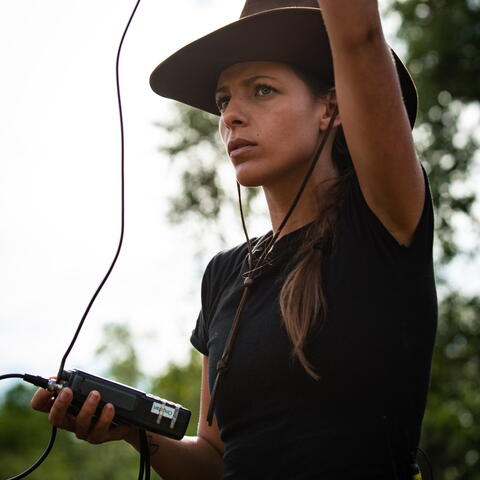 Woman with radio collar tracking receiver 