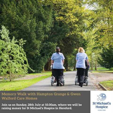 people pushing others in wheelchairs through country park