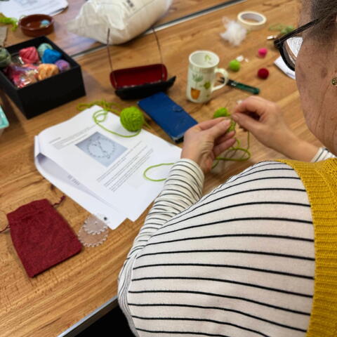 Person involved in a wool workshop/course