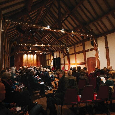 Full audience at a concert inside Hellens Manor