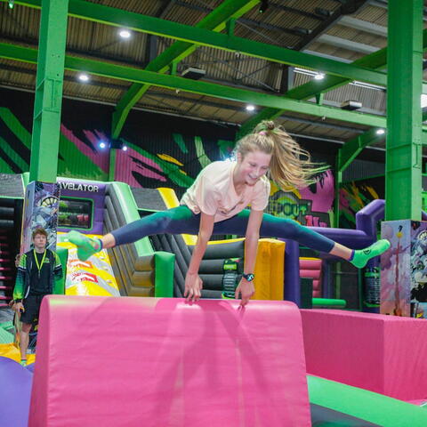 National Play Day poster with a child in an indoor play centre