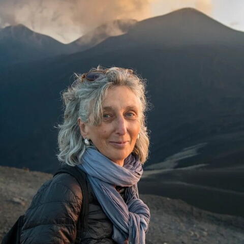 A person with mountains in the background