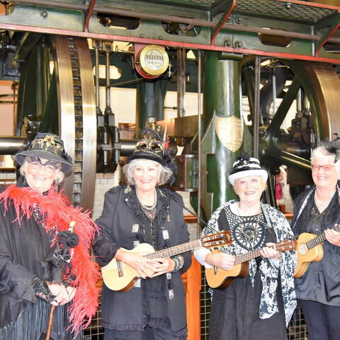 4 Ladies Dressed in Victorian attire