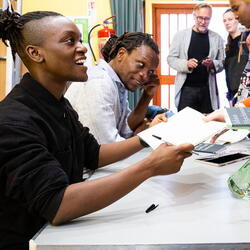 Two Authors signing books